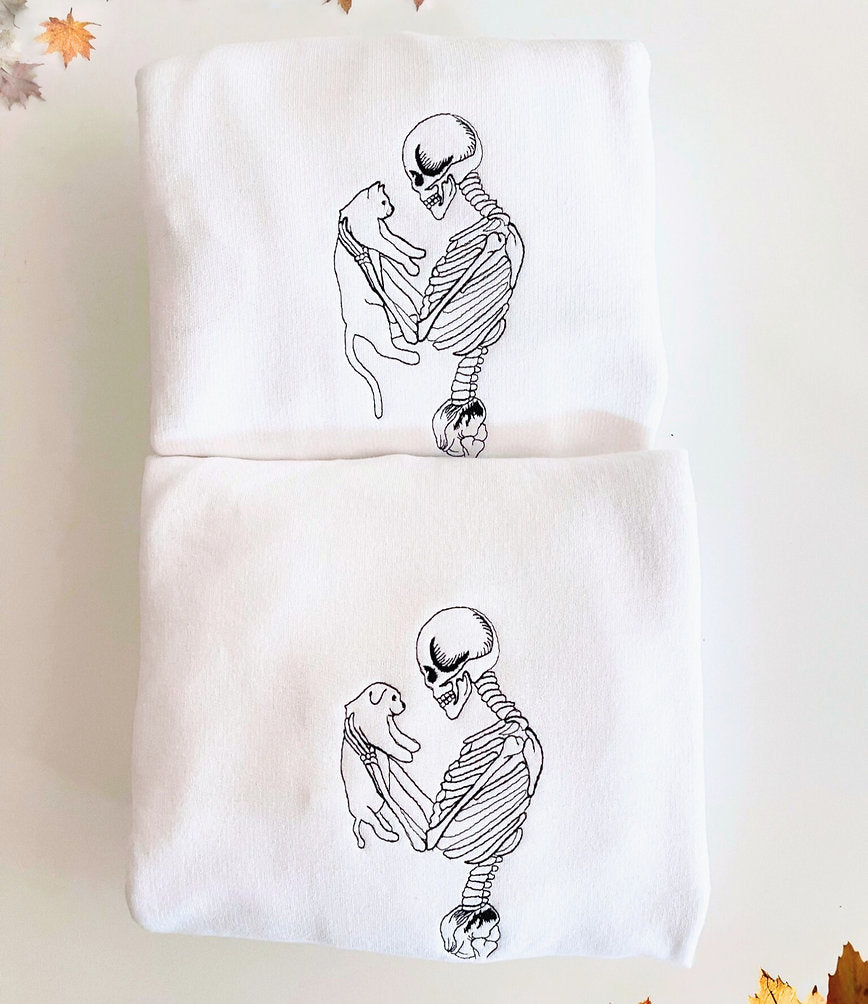Skeleton Holding Cat and Dog Sweatshirt